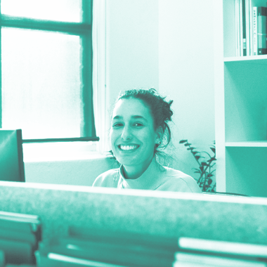 Woman smiling at desk